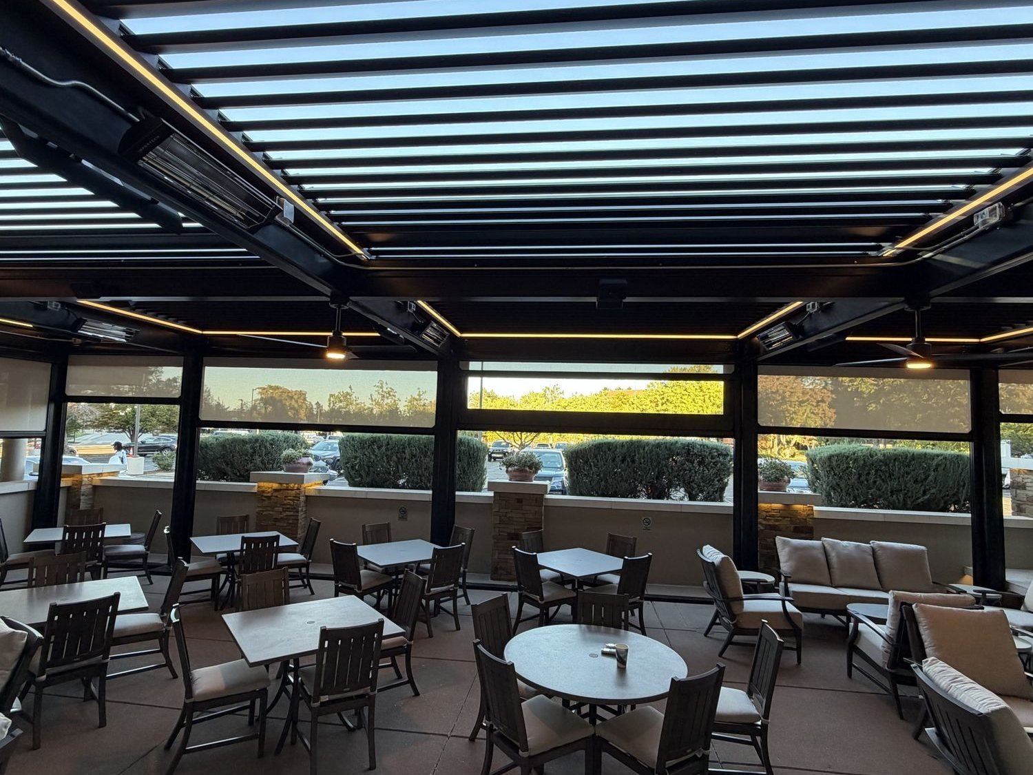Louvered pergola with motorized screens over a steakhouse patio in Greenwood Village, Colorado